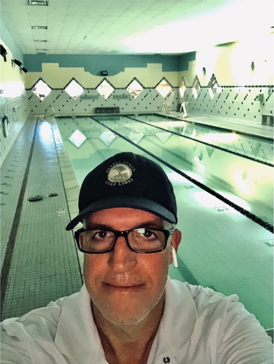Chris, founder of Swimming Pool Resource, wearing his pool service hat and polo shirt