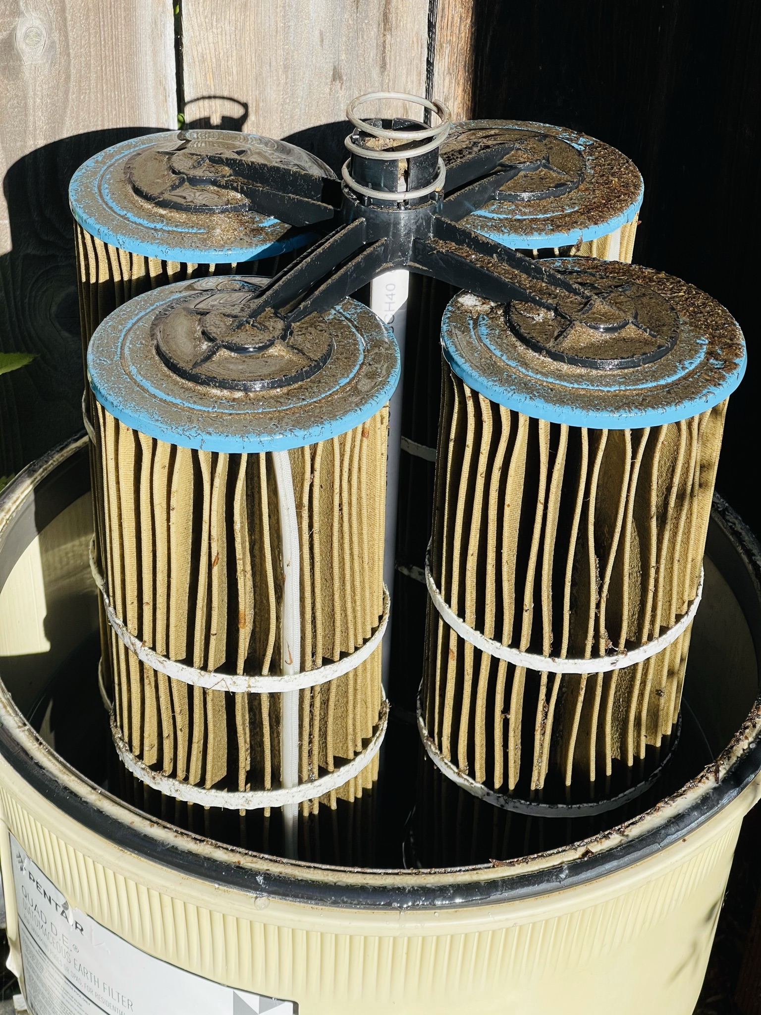 Heavily fouled pool filter cartridges that can restrict flow and contribute to high filter pressure